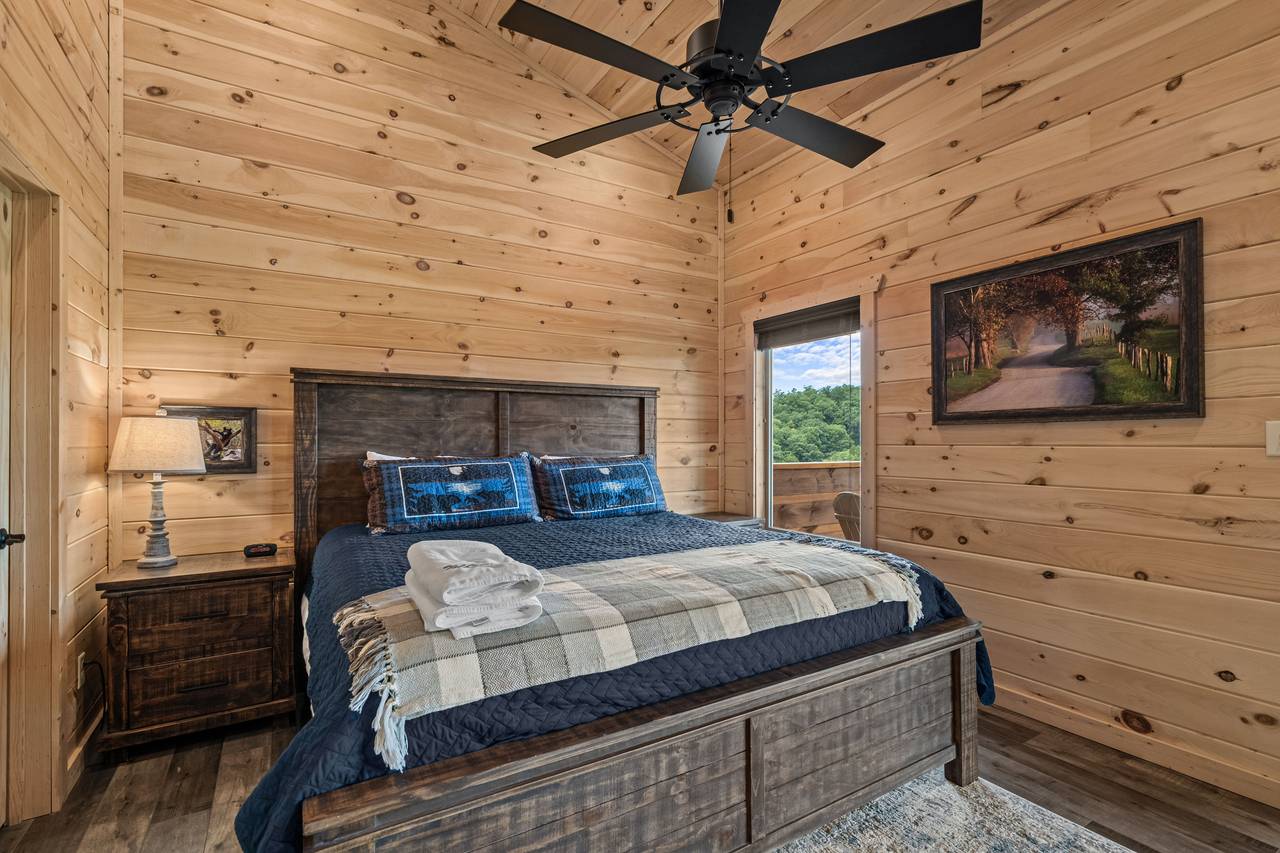 Upper level king with TV and shared ensuite full bath Upper level king with TV and shared ensuite full bath