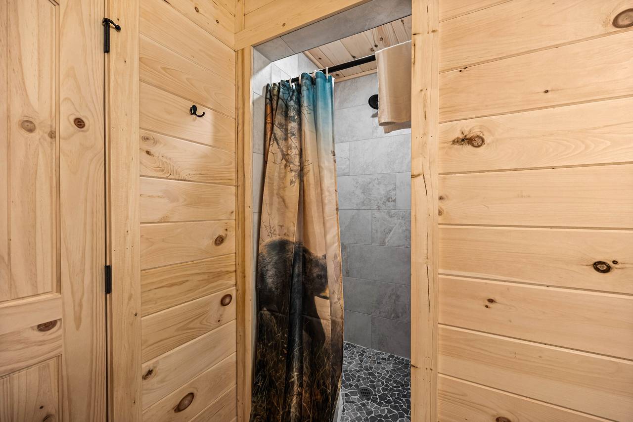 Upper level king ensuite full bath with standing shower Upper level king ensuite full bath with standing shower