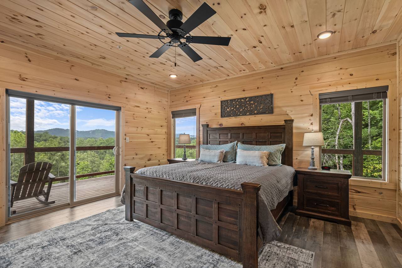 Entry level king bedroom with TV, fireplace, & ensuite full bath Entry level king bedroom with TV, fireplace, & ensuite full bath