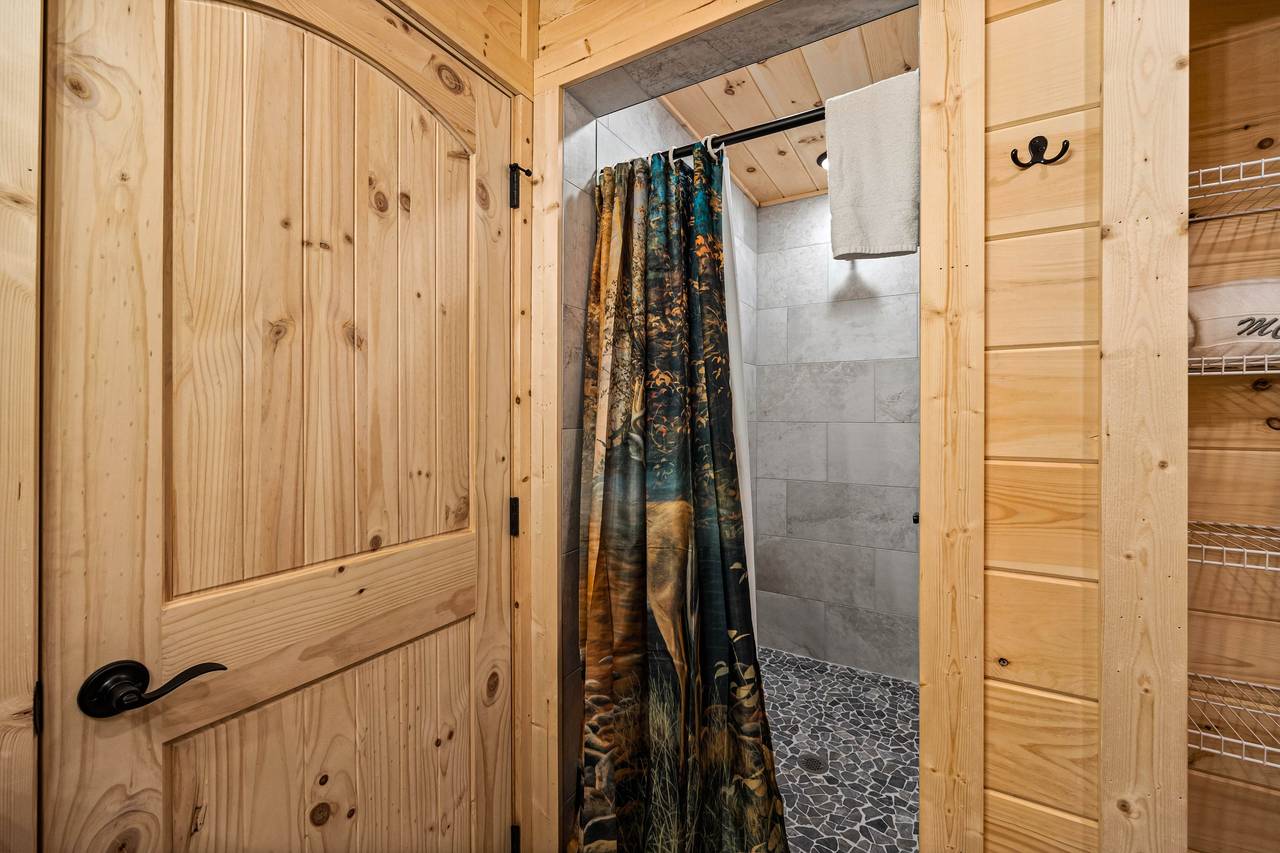 Upper level king ensuite full bath with standing shower Upper level king ensuite full bath with standing shower