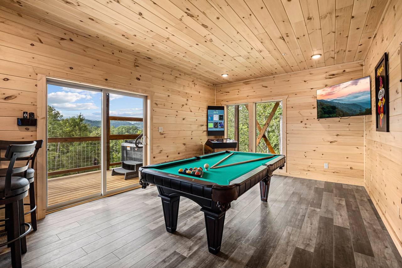 Game room with pool table, multi-cade arcade, & Golden Tee Game room with pool table, multi-cade arcade, & Golden Tee
