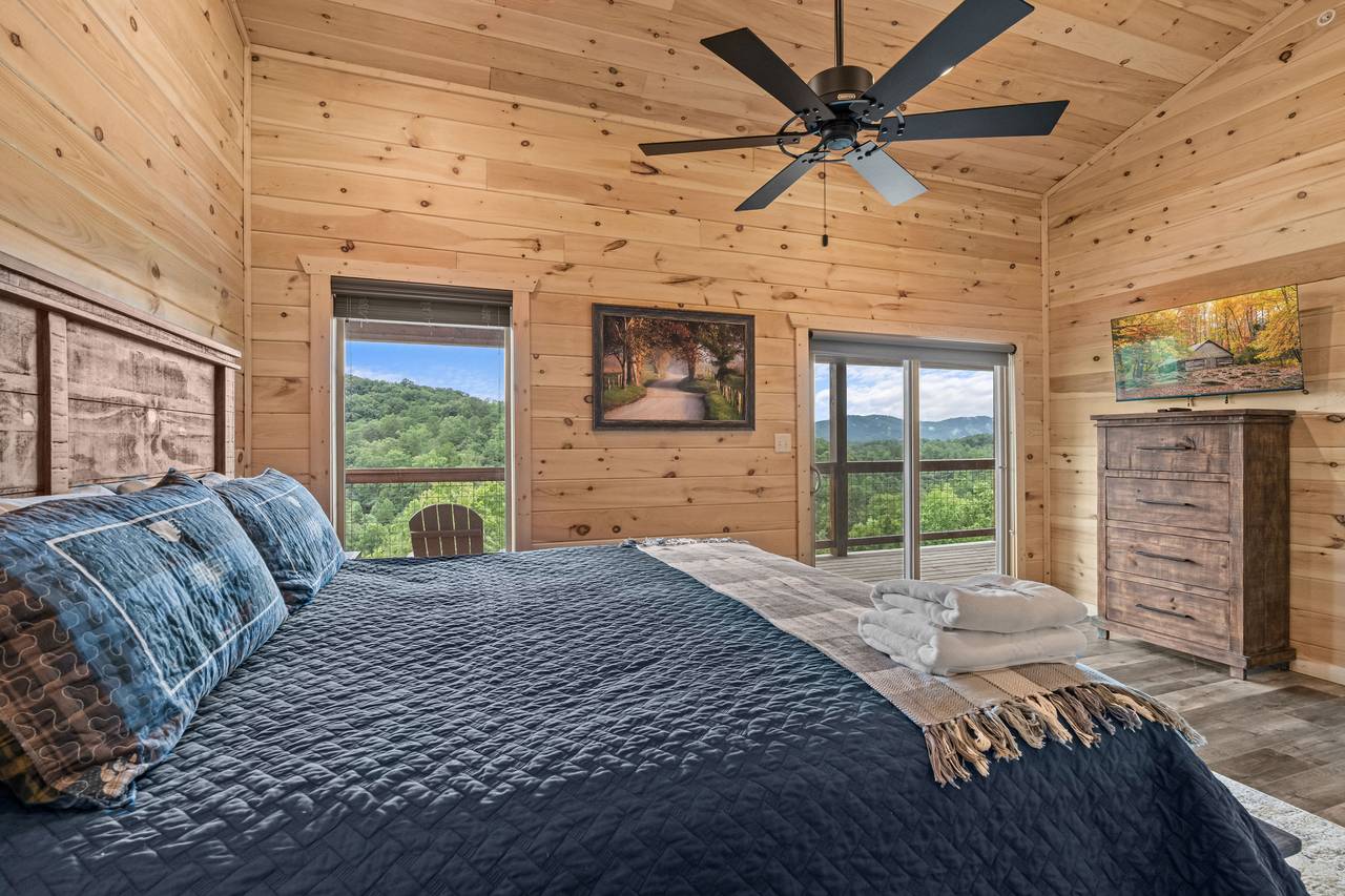 Upper level king with TV and shared ensuite full bath Upper level king with TV and shared ensuite full bath