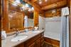 Entry level shared bath with jacuzzi tub and shower Entry level shared bath with jacuzzi tub and shower