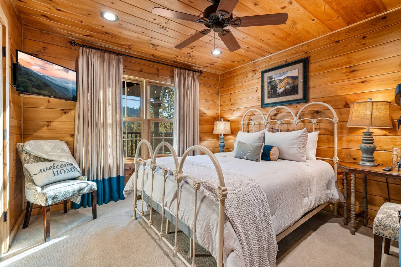 Lower level queen bedroom with TV Lower level queen bedroom with TV
