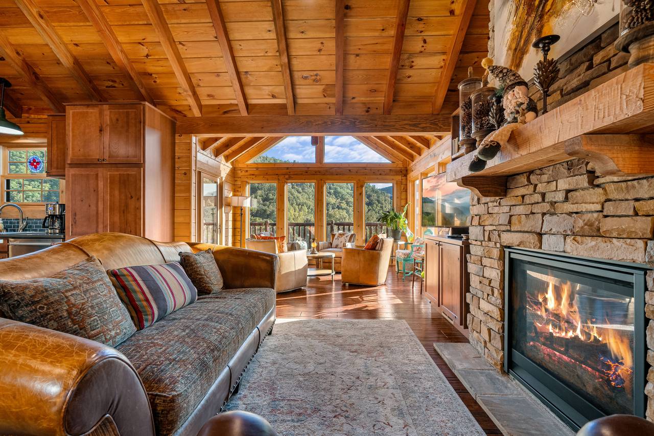 Living room with gas fireplace, TV, and comfy seating. Living room with gas fireplace, TV, and comfy seating.