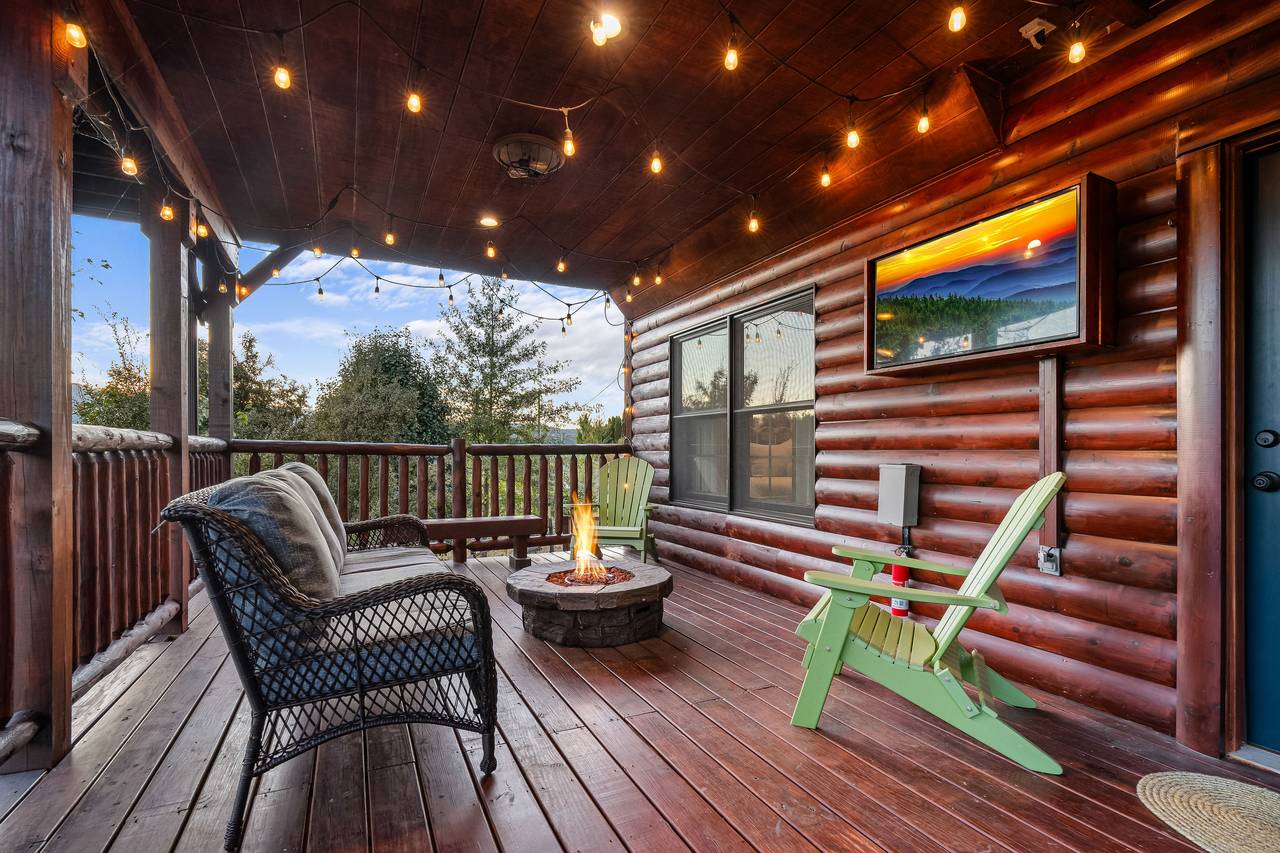 Outdoor seating with gas fire pit and TV Outdoor seating with gas fire pit and TV