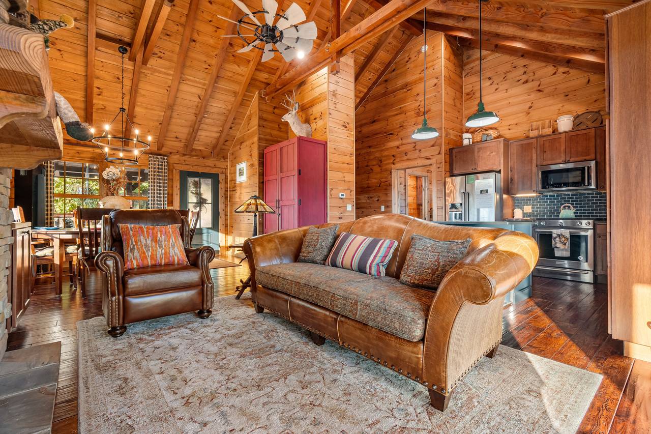 Living room with gas fireplace, TV, and comfy seating. Living room with gas fireplace, TV, and comfy seating.