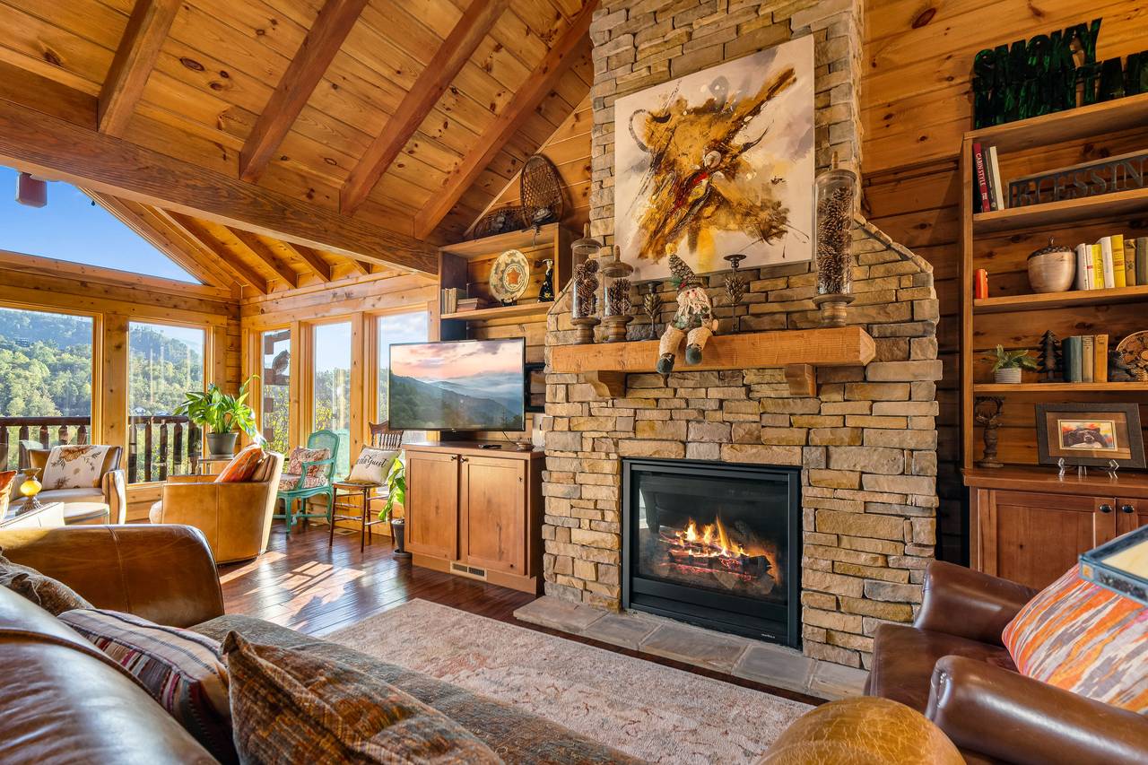 Living room with gas fireplace, TV, and comfy seating. Living room with gas fireplace, TV, and comfy seating.