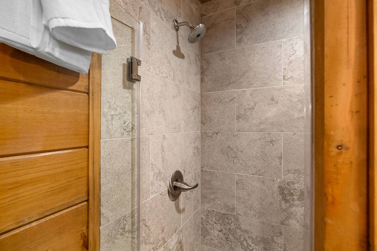 Lower level king ensuite full bath with standing shower Lower level king ensuite full bath with standing shower