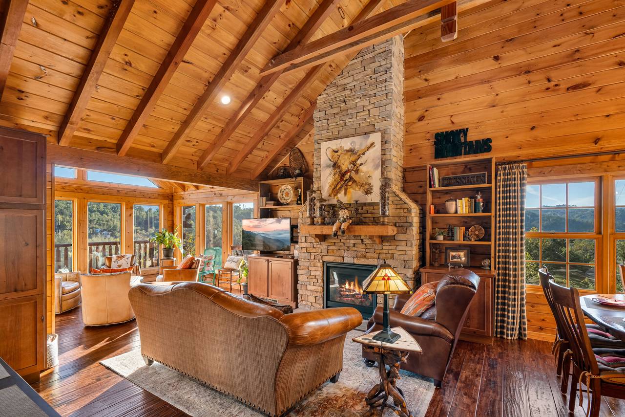 Living room with gas fireplace, TV, and comfy seating. Living room with gas fireplace, TV, and comfy seating.