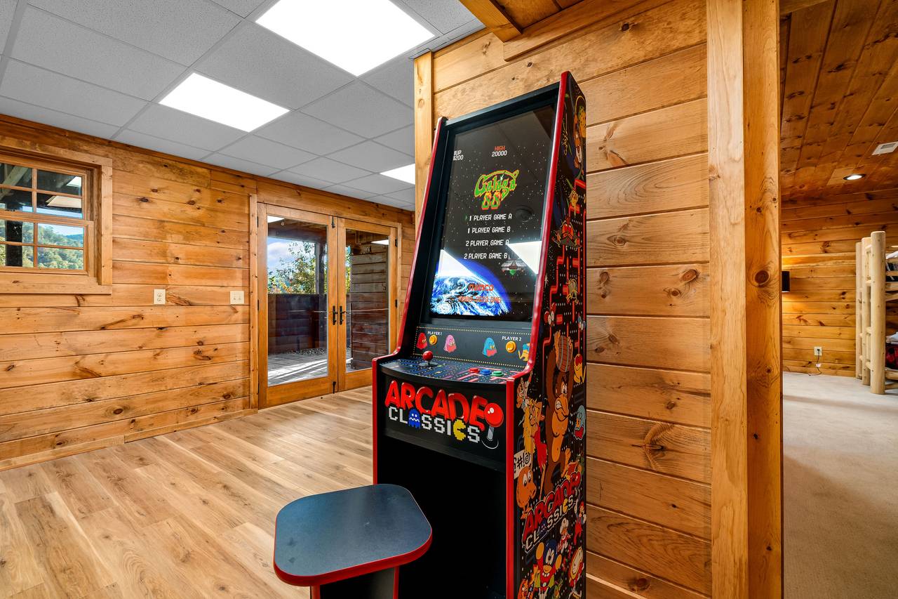 Game room with treadmill, ping pong, & 2 multi-cade arcades Game room with treadmill, ping pong, & 2 multi-cade arcades