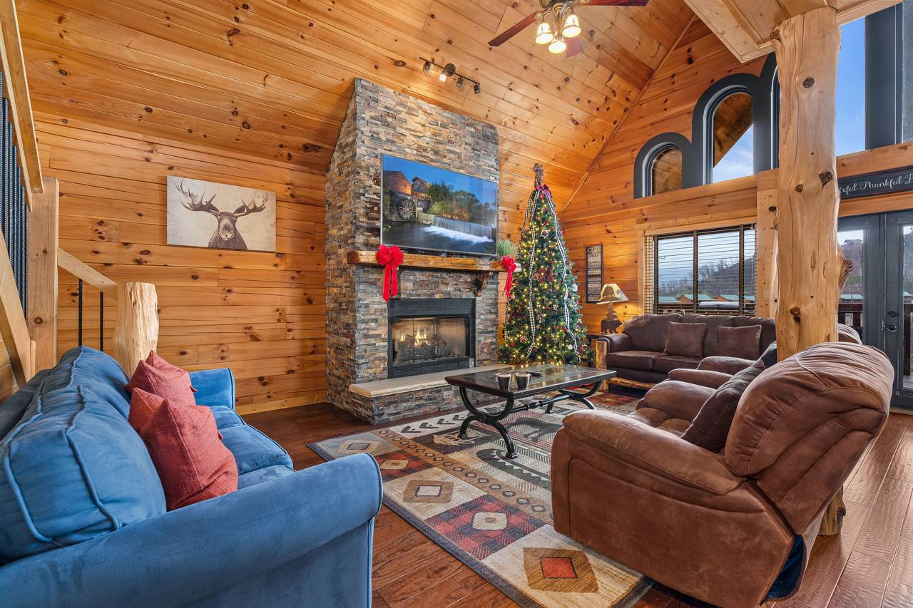 Spacious living room with fireplace, 2 sleeper sofas, & TV. Spacious living room with fireplace, 2 sleeper sofas, & TV.
