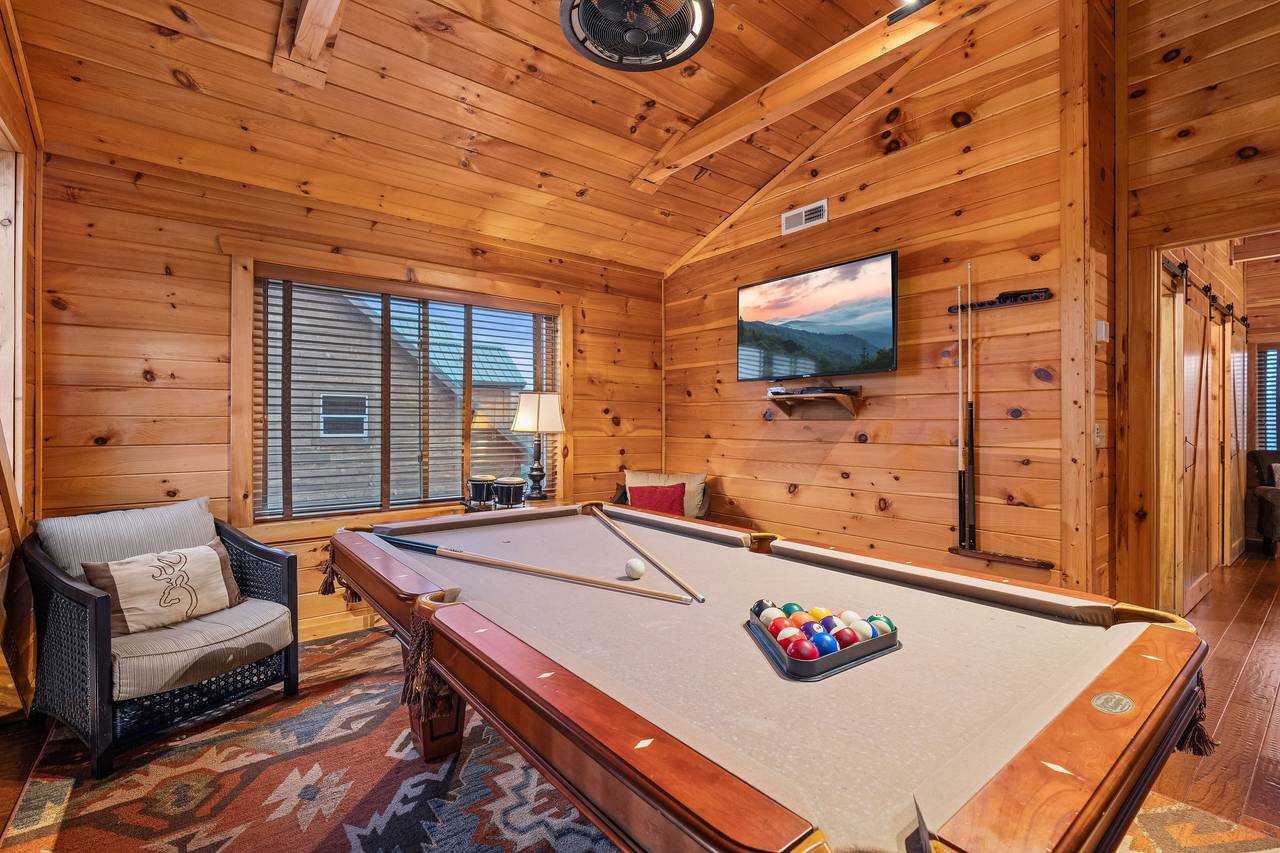 Upper level loft with pool table, comfy seating, and TV Upper level loft with pool table, comfy seating, and TV