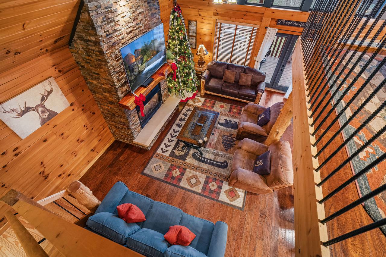 Upper level loft looking down onto the living room. Upper level loft looking down onto the living room.