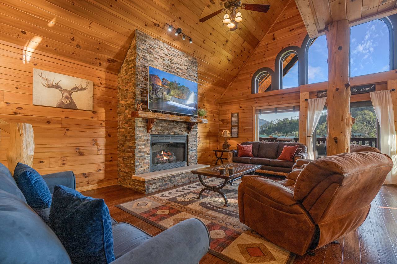 Spacious living room with fireplace, 2 sleeper sofas, & TV. Spacious living room with fireplace, 2 sleeper sofas, & TV.