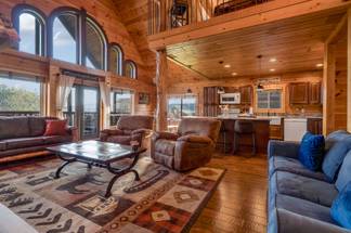 Spacious living room with fireplace, 2 sleeper sofas, & TV. Spacious living room with fireplace, 2 sleeper sofas, & TV.