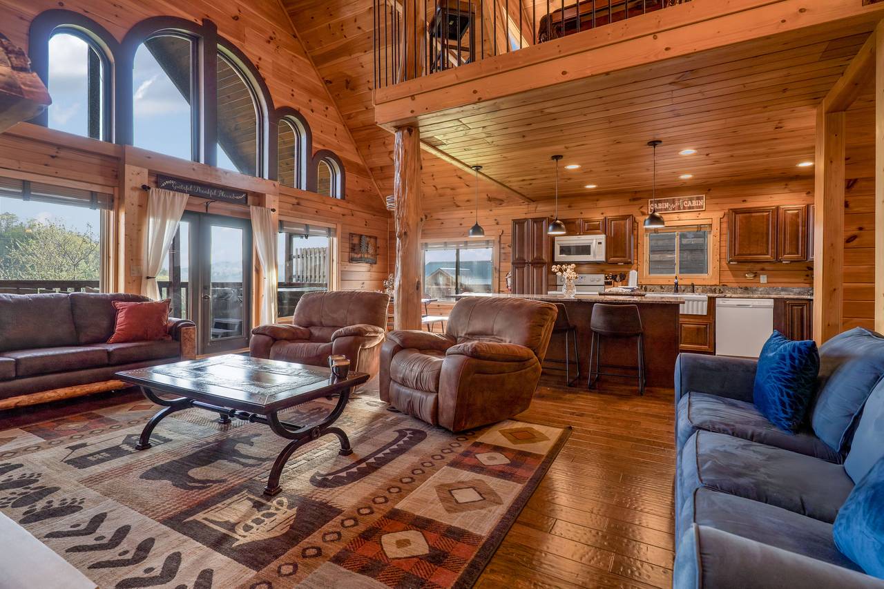 Spacious living room with fireplace, 2 sleeper sofas, & TV. Spacious living room with fireplace, 2 sleeper sofas, & TV.