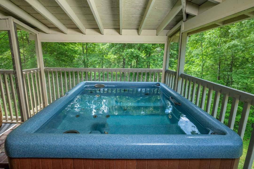 Relax in your private hot tub, covered on the screened porch!