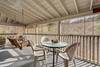 Outdoor dining & porch swing, covered on screened porch Outdoor dining & porch swing, covered on screened porch