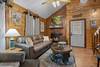 Living room with TV, comfy seating, and fireplace. Living room with TV, comfy seating, and fireplace.