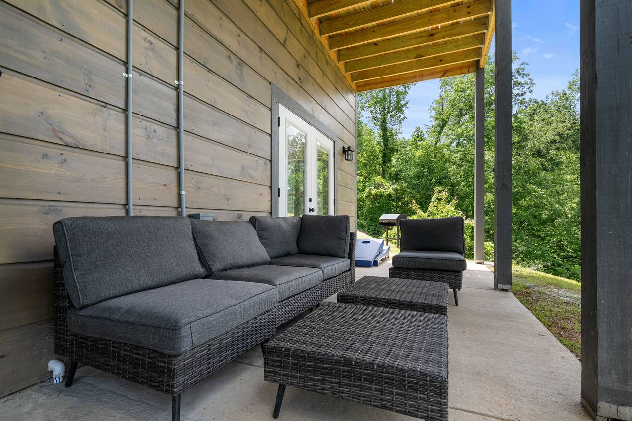 Covered Deck With Seating and Scenic Views Covered Deck With Seating and Scenic Views