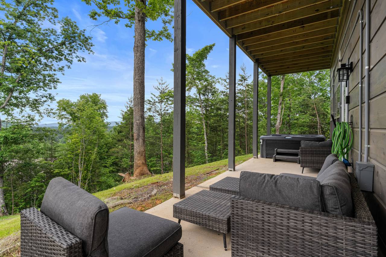 Covered Deck With Seating and Scenic Views Covered Deck With Seating and Scenic Views