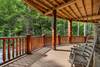 Wrap-around deck with rocking chairs & forest views Wrap-around deck with rocking chairs & forest views