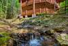 Soothing mountain stream runs beside the cabin Soothing mountain stream runs beside the cabin