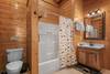 Main level ensuite with walk-in shower & rustic charm Main level ensuite with walk-in shower & rustic charm