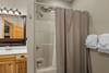 Lower level ensuite with tub/shower combo & vanity Lower level ensuite with tub/shower combo & vanity