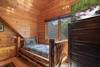 Upper level king bedroom with twin bed & log decor Upper level king bedroom with twin bed & log decor