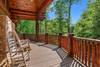 Wrap-around deck with rocking chairs & forest views Wrap-around deck with rocking chairs & forest views