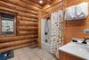 Main level ensuite with walk-in shower & rustic charm Main level ensuite with walk-in shower & rustic charm