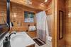 Upper level ensuite with tub/shower & mountain decor Upper level ensuite with tub/shower & mountain decor