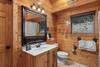 Upper level ensuite with tub/shower & mountain decor Upper level ensuite with tub/shower & mountain decor