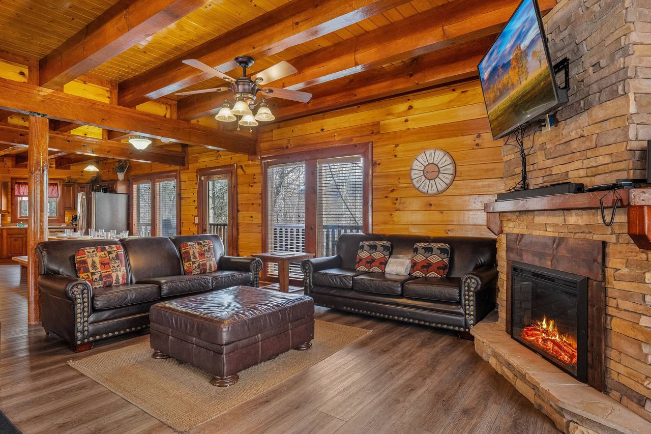 Relax by the cozy stone fireplace. Relax by the cozy stone fireplace.