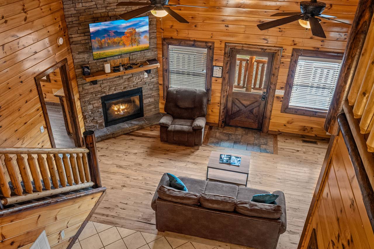 <span class="name">Living room with gas fireplace and TV.</span> <span class="name">Living room with gas fireplace and TV.</span>