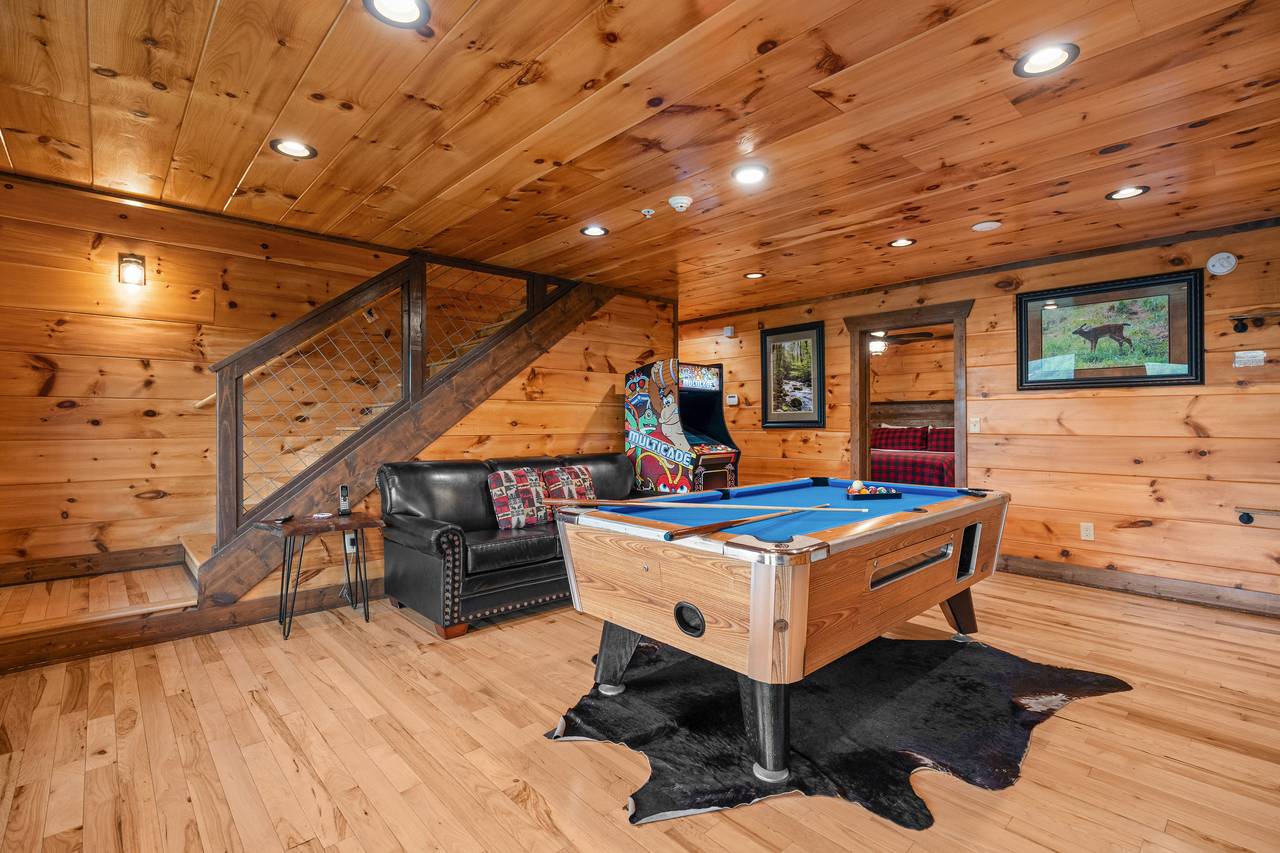 Lower level game room with pool table, arcage game, & TV Lower level game room with pool table, arcage game, & TV