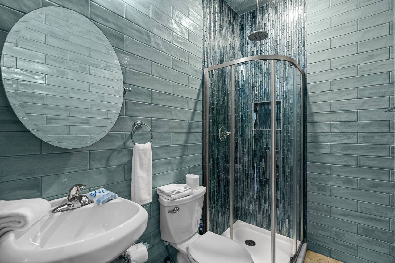 Full bathroom with standing shower in the pool room. Full bathroom with standing shower in the pool room.