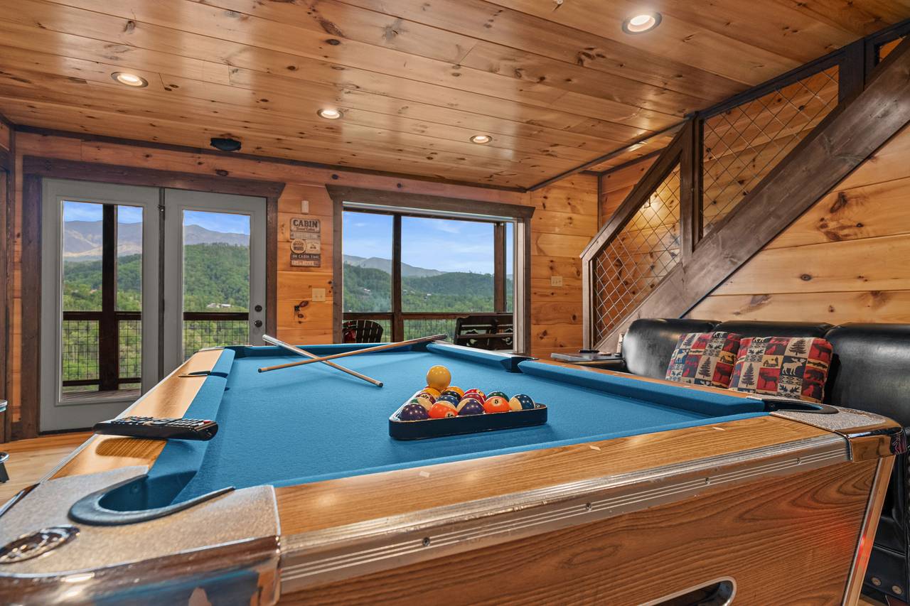 Lower level game room with pool table, arcage game, & TV Lower level game room with pool table, arcage game, & TV
