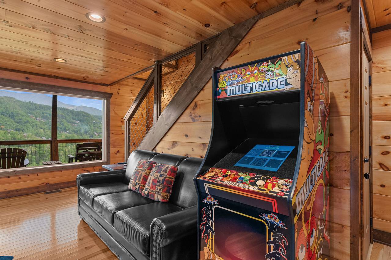Lower level game room with pool table, arcage game, & TV Lower level game room with pool table, arcage game, & TV