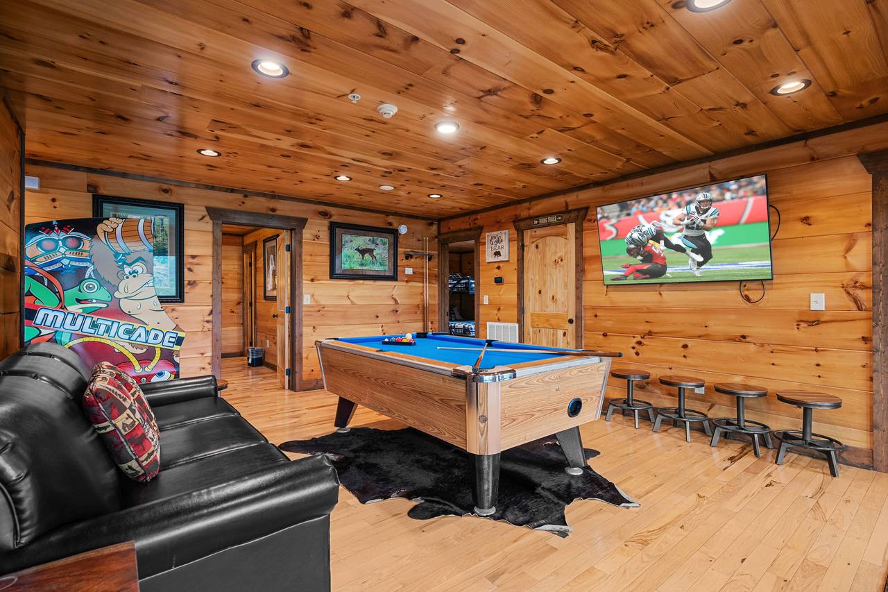 Lower level game room with pool table, arcage game, & TV Lower level game room with pool table, arcage game, & TV