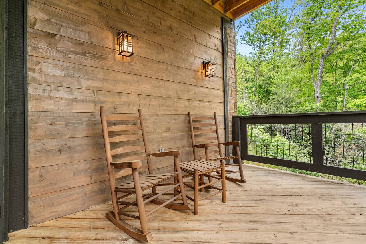 Unwind in a rocking chair on the peaceful deck Unwind in a rocking chair on the peaceful deck