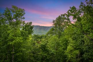 Relax on the deck with seating and Smoky Mountain views Relax on the deck with seating and Smoky Mountain views