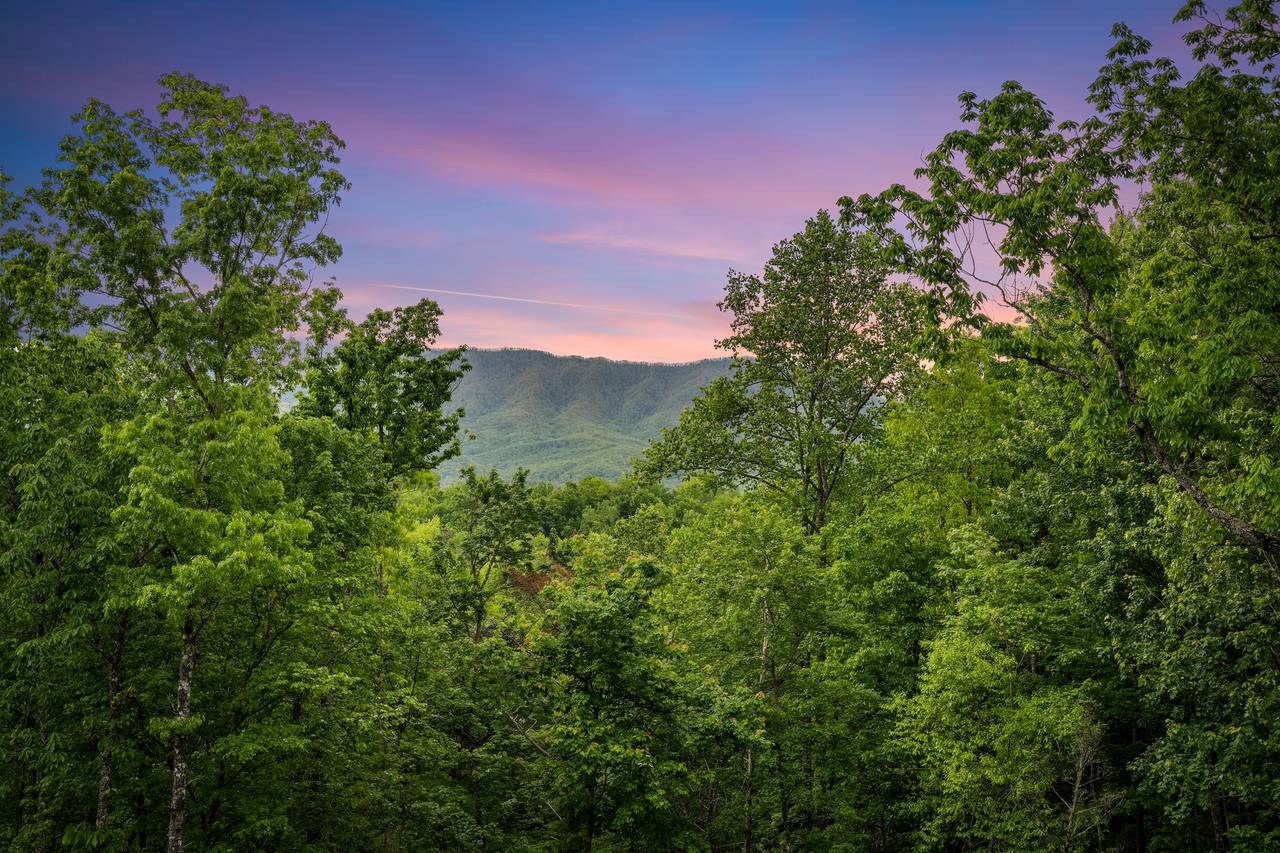 Relax on the deck with seating and Smoky Mountain views Relax on the deck with seating and Smoky Mountain views