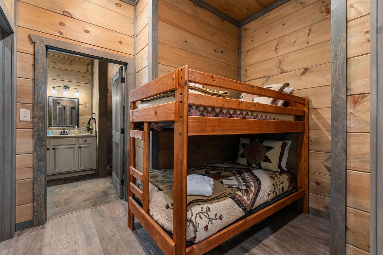 Cozy twin bunk beds just off the game room and lower living area Cozy twin bunk beds just off the game room and lower living area