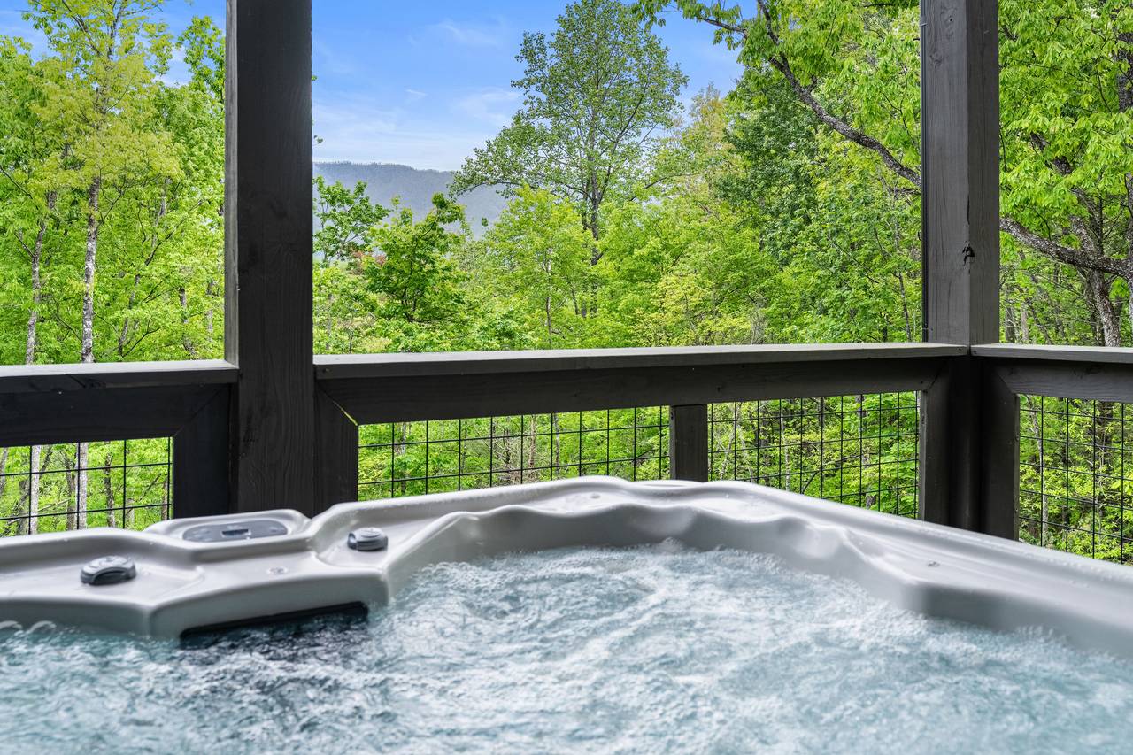 Relax & unwind with mountain views from the bubbling hot tub! Relax & unwind with mountain views from the bubbling hot tub!