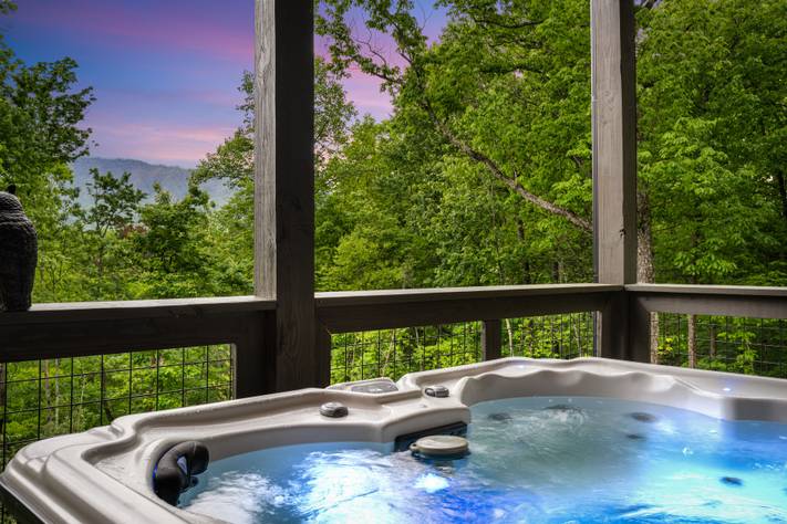 Relax & unwind with mountain views from the bubbling hot tub! Relax & unwind with mountain views from the bubbling hot tub!