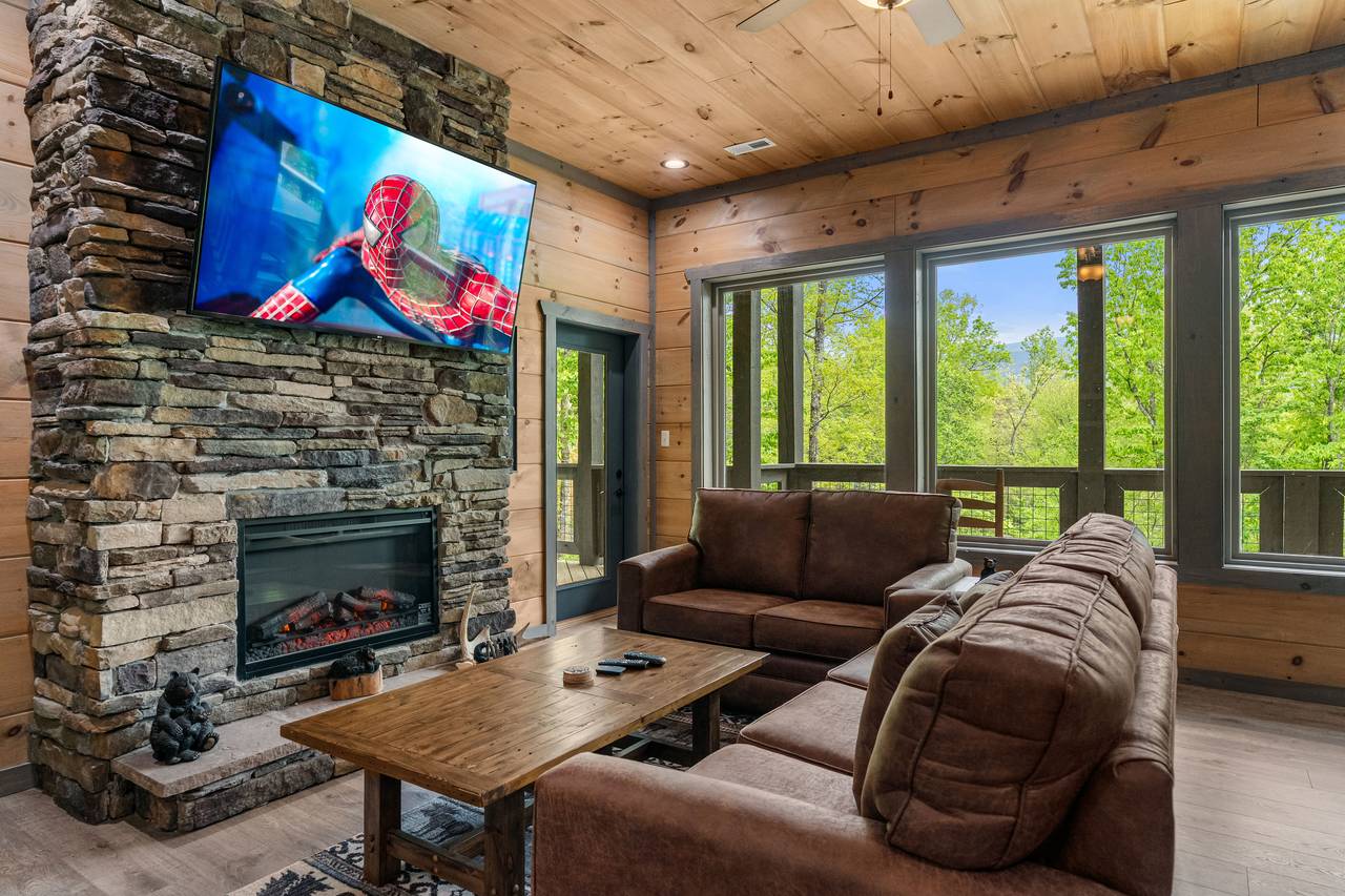 Lounge in style with a fireplace, wet bar, and cozy seating! Lounge in style with a fireplace, wet bar, and cozy seating!