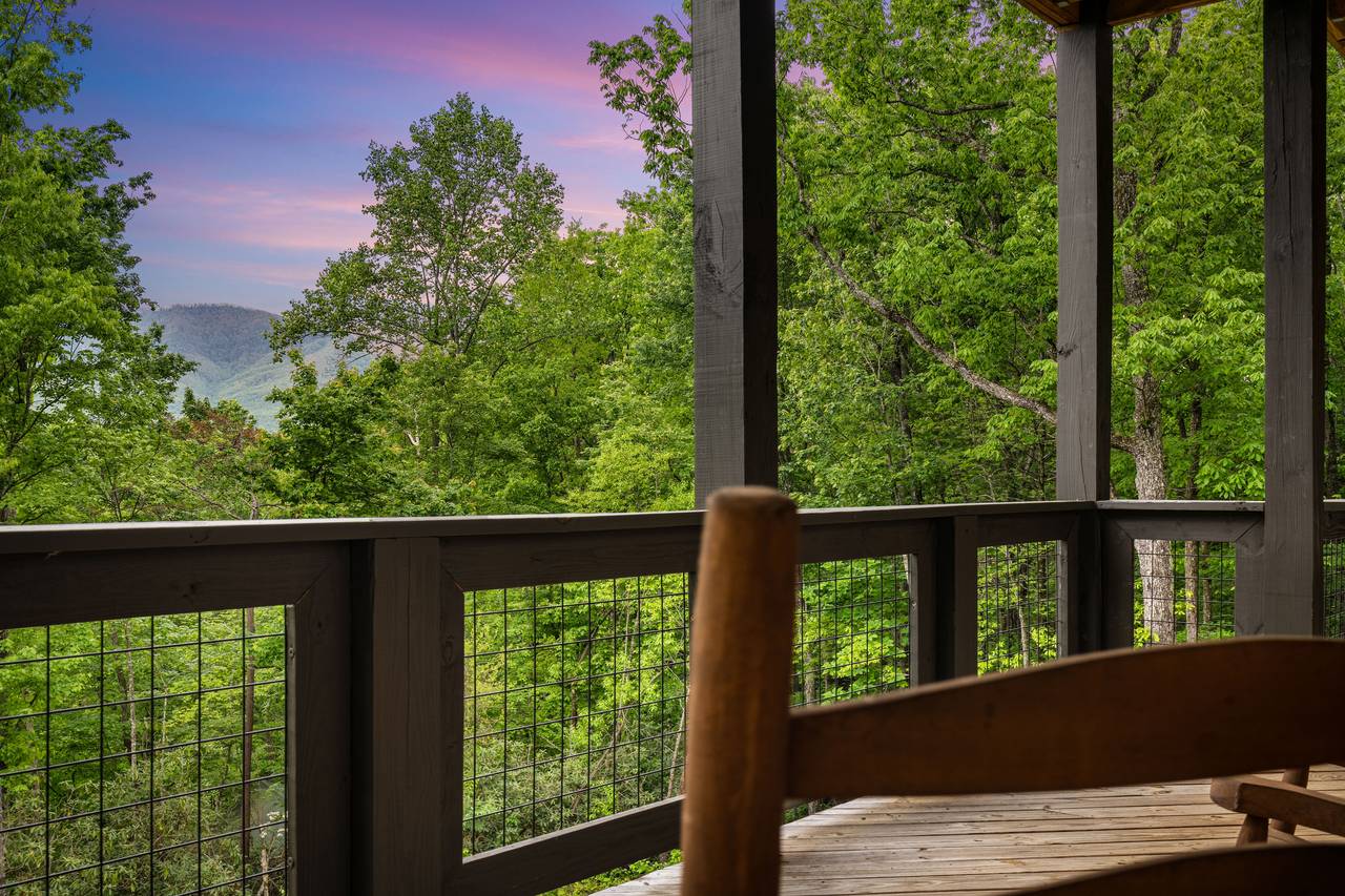 Relax on the deck with seating and Smoky Mountain views Relax on the deck with seating and Smoky Mountain views
